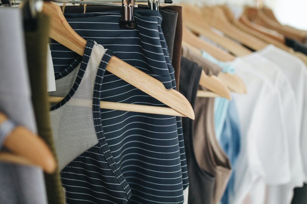 Close up photo of clothing hanging on a rack