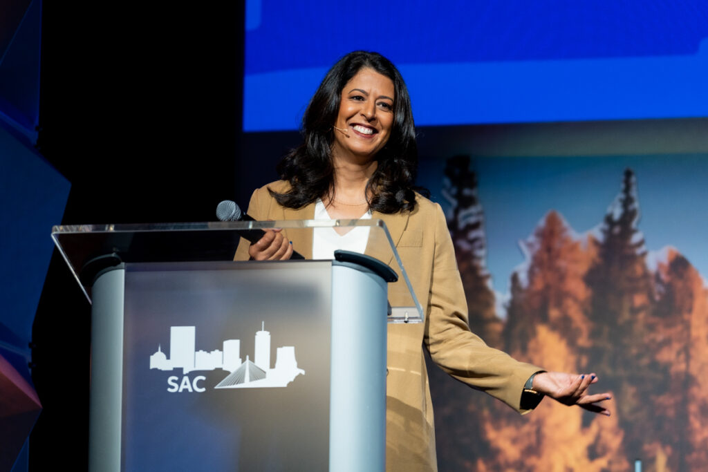 Photo of Amina Razvi on stage at the 2023 Annual Meeting