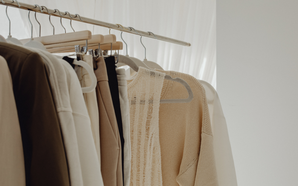 Natural colored clothing hanging on a rack