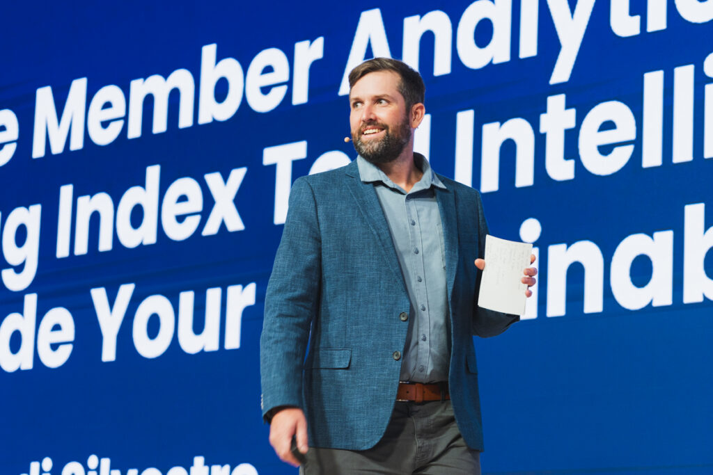 Aaron di Silvestro on stage at a Cascale Annual Meeting