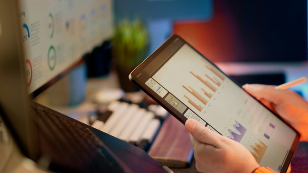 A close-up of an iPad with graphs simulated on the screen.