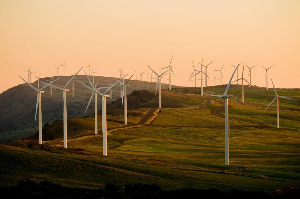 Wind turbines with a sunset hillscape