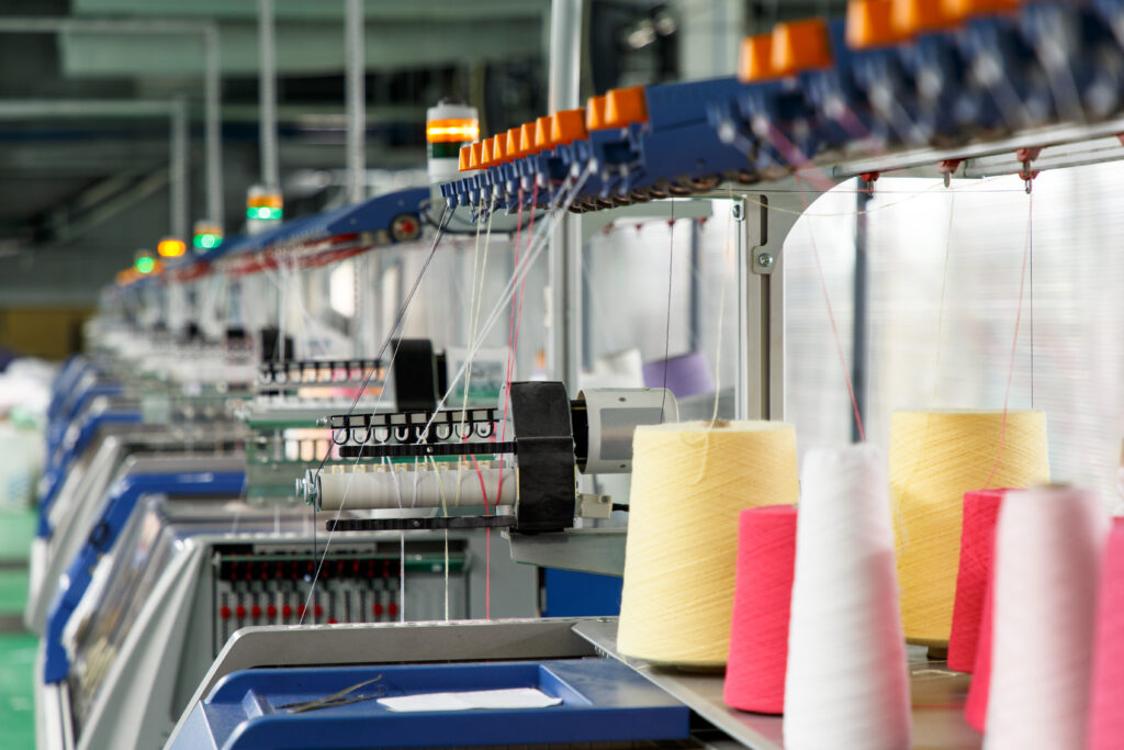 Textile industry with knitting machines in factory